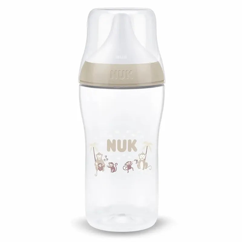 Biberon NUK Perfect Match 260ml 3m+ beige avec tétine souple en silicone et motifs singes anti-colique.