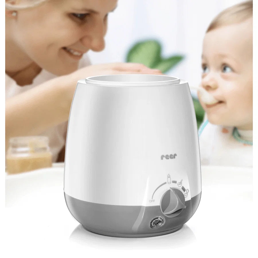 Chauffe-biberon electrique Reer Simply Hot gris et blanc sans BPA pour lait maternel et petits pots bebe.